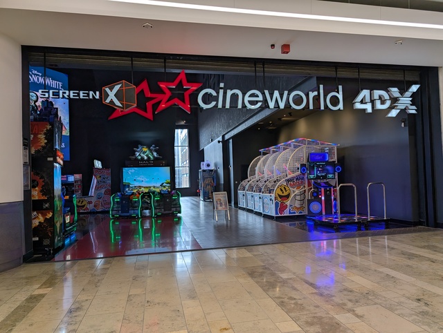 Entrance signage with arcade machines that have replaced the former Starbucks concession