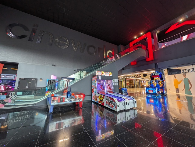Entrance foyer escalators leading to concessions counters and screens