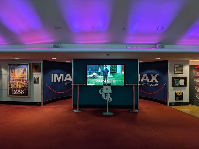 Concessions Foyer screen displaying poster for Parasite