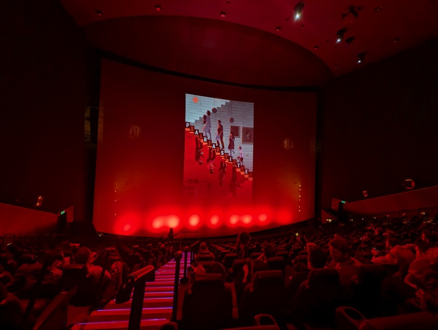 Screen showing slideshow featuring Parasite poster