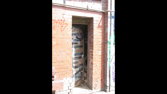 Open door in lane, Grand Theatre, Paisley Street, Footscray
