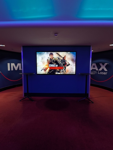Concessions foyer screen displaying poster for Edge of Tomorrow