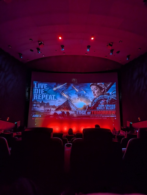 Screen showing slideshow with Edge of Tomorrow poster as part of 2025 BFI Tom Cruise season.