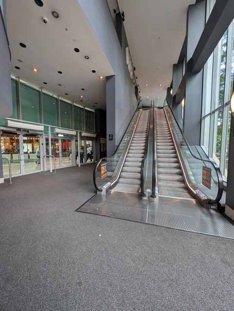 Entrance foyer escalators leading to concessions counters and screens