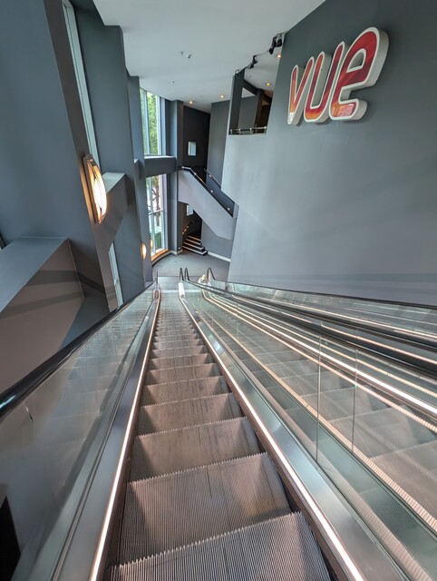 Entrance foyer escalators leading to concessions counters and screens