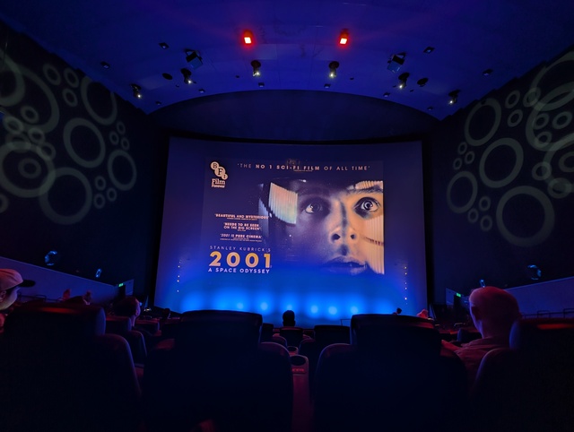 Screen showing slideshow with 2001 A Space Odyssey poster