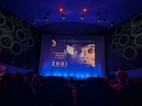 Screen showing slideshow with 2001 A Space Odyssey poster