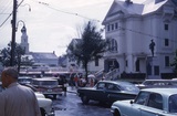 <p>A 1961 image. The center building behind the tree would house the Art Cinema which became the Metro Cinema. On the right is the town hall. From Wikipedia.</p>
              