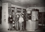 ["Local boys outside the Penn Theatre circa 1952."]