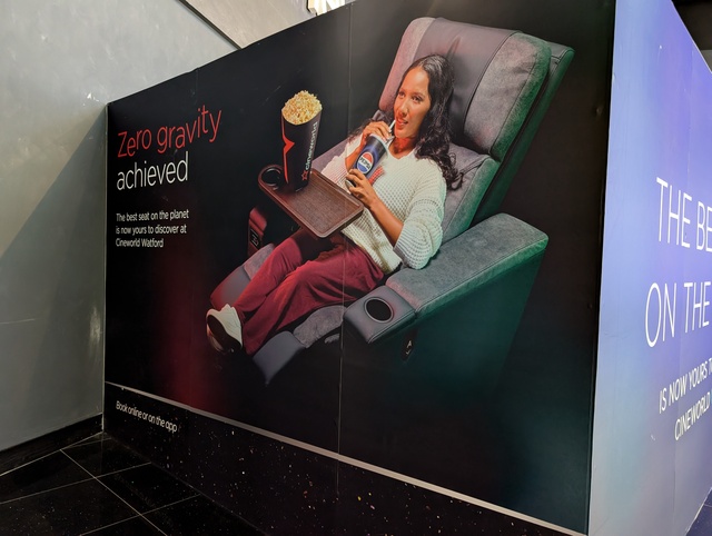 Lower foyer advertising for the cinemas new "Best seat on the planet" which has replaced the previous Starbucks Concession