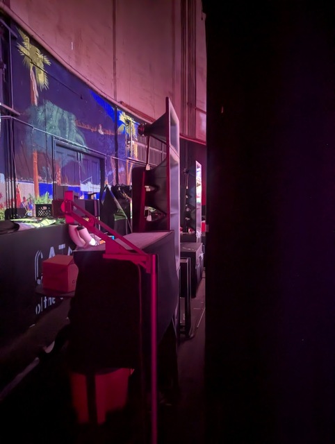 Speakers behind the screen