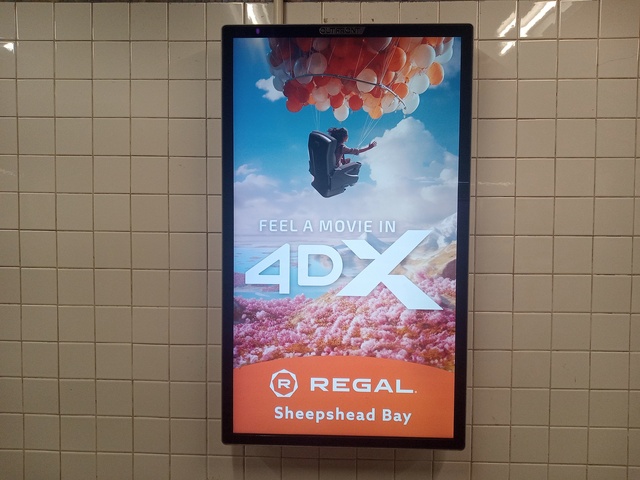 Close-up of Regal Sheepshead Bay 4DX ad in MTA-NYCT subway station