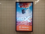 ["Close-up of Regal Sheepshead Bay 4DX ad in MTA-NYCT subway station"]