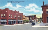 Marquee of East Palestine Theatre on the right in this postcard view of the Market Street business district 