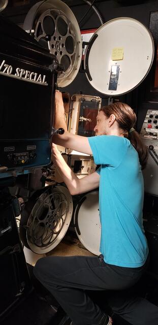 Projectionist Threading Up 35mm Projector