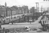 <p>Infantry Hall tower, left, Columbia Showboat Theatre, center rear. 1897, Providence Harbor.</p>
              