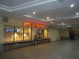 <p>The dormant AMC Sunset Place box office, located on the second floor of the mall underneath the cinema, taken on December 7, 2025.</p>
            
              <p>Titles that are playing and showtimes are still viewable on the electronic screens, but the blue sign standing in the middle directs people to buy tickets at what is actually customer service inside the cinema&rsquo;s entrance on the third floor.</p>
            
              <p>Years ago, the open area in front was sometimes roped off to form a line, which would fill up on weekend nights, with most or all of the twelve box office windows in use.</p>
            
              <p>I used to enjoy the communal feeling of standing in line with people whom I did not know who had shown up at the same time as me, all going to the movies, (unless I was concerned the line was making me late for the show, to then discover I had only missed some of the trailers once I got in the auditorium.  : ) )</p>
            
              <p>Moviegoers would then take the escalator on the far right of the photo up to the third floor, and walk past eight movie poster boxes to the cinema&rsquo;s entrance.</p>
            
              <p>Several self-serve kiosks were eventually added along the wall to the right of the box office, and less of the box office windows were staffed&hellip; Then a couple years later none of the windows were staffed and just the kiosks were in use&hellip; Then at some point the kiosks were removed and customers were directed upstairs.</p>
            
              <p>I still miss the fully operational communal box office experience.</p>
              